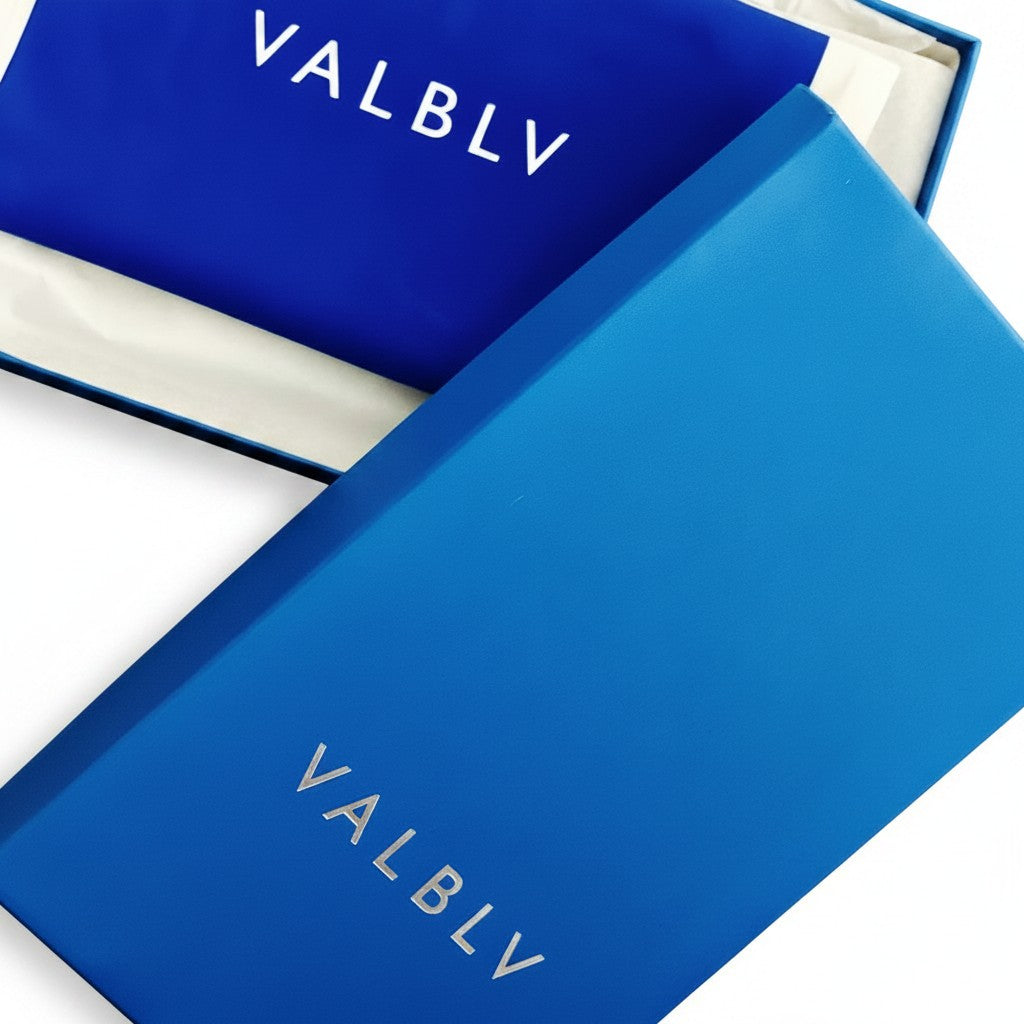 V A L B L V branded blue shoe box and dust bag with white logo lettering for luxury Italian footwear packaging