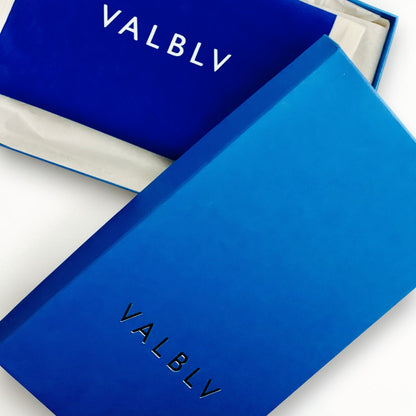 V A L B L V branded blue shoe box and lid featuring minimalist logo design for luxury Italian ballerina flats