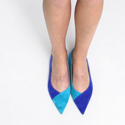 V A L B L V pointed toe ballerina flats in two-tone sea and sky blue suede worn on feet against a white background.